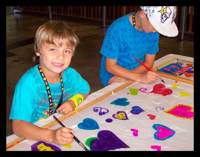 Boys love learning how to paint on silk at the Royal Easter Show in Sydney, 12th April 2010