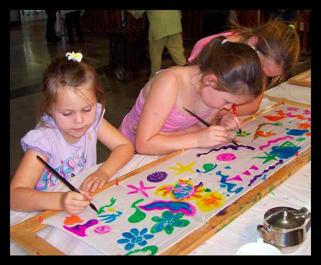 3 Sisters learning how to paint on silk at the Royal Easter Show in Sydney, 12th April 2010