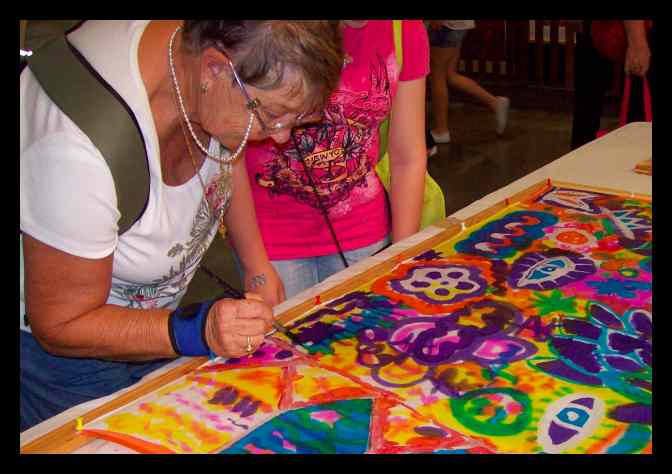 Learning how to paint on silk - from young children to our wise elders, they all had fun